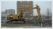 excavator begins digging at sewells road construction site